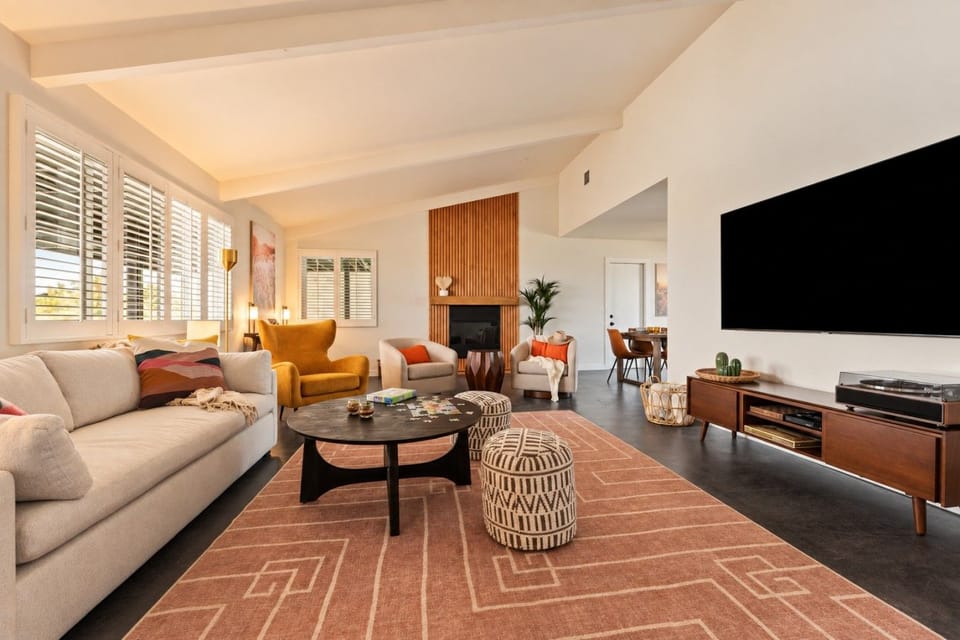 Settle into a warm, inviting living room designed for cozy evenings, games, music, and time together.