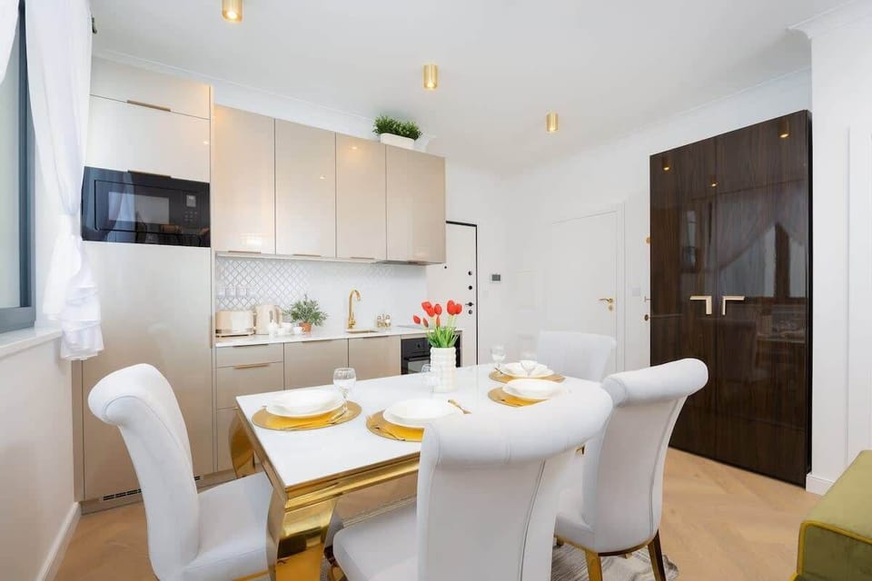 Bright kitchen with cooking utensils. 