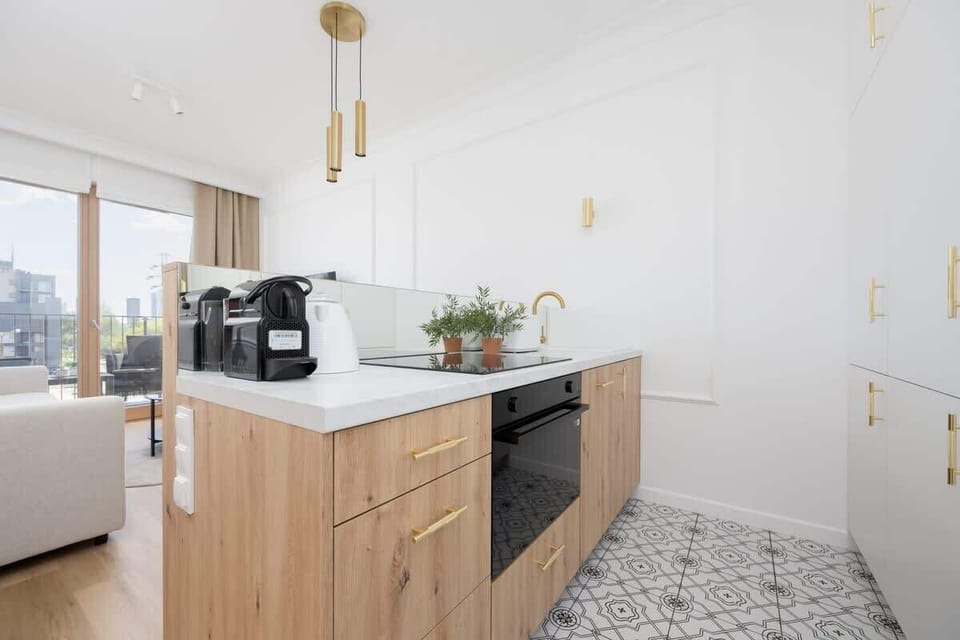 Kitchenette with oven and refrigerator. 