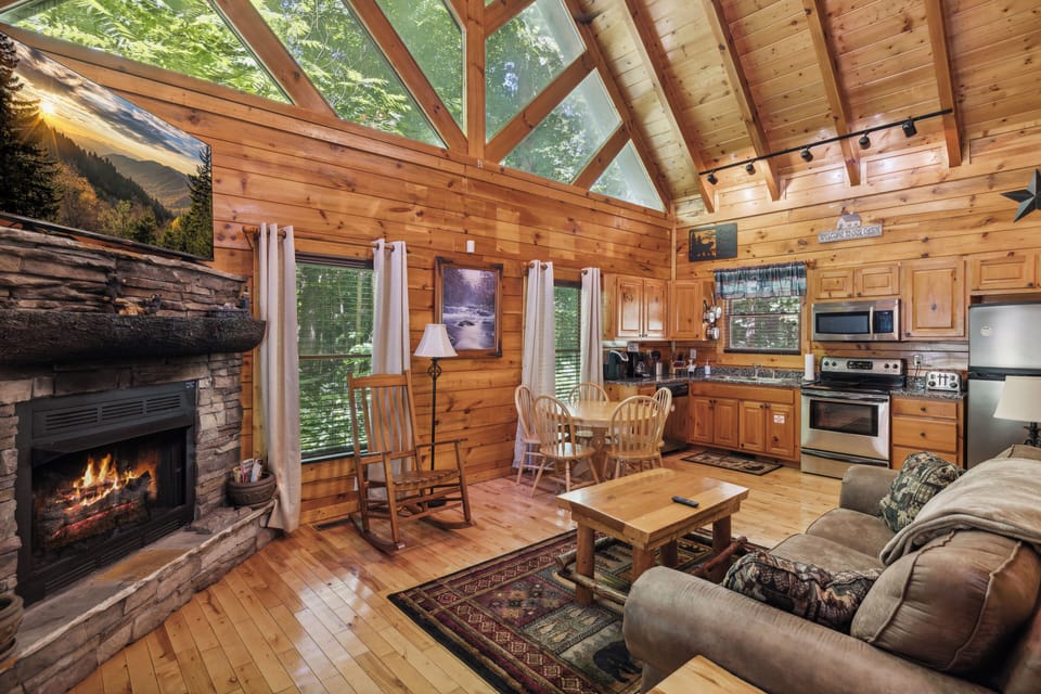 Enjoy the warmth of the fireplace while watching your favorite television show or just taking in the view through the majestic windows.