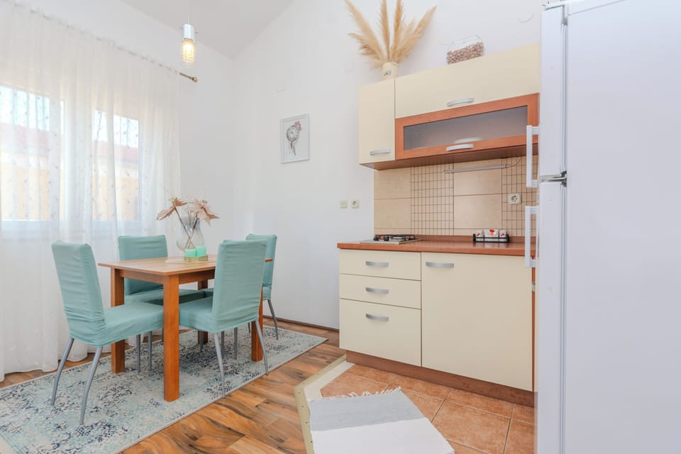 Comfort Apartment, Garden View | Private kitchen | Full-size fridge, microwave, stovetop, electric kettle