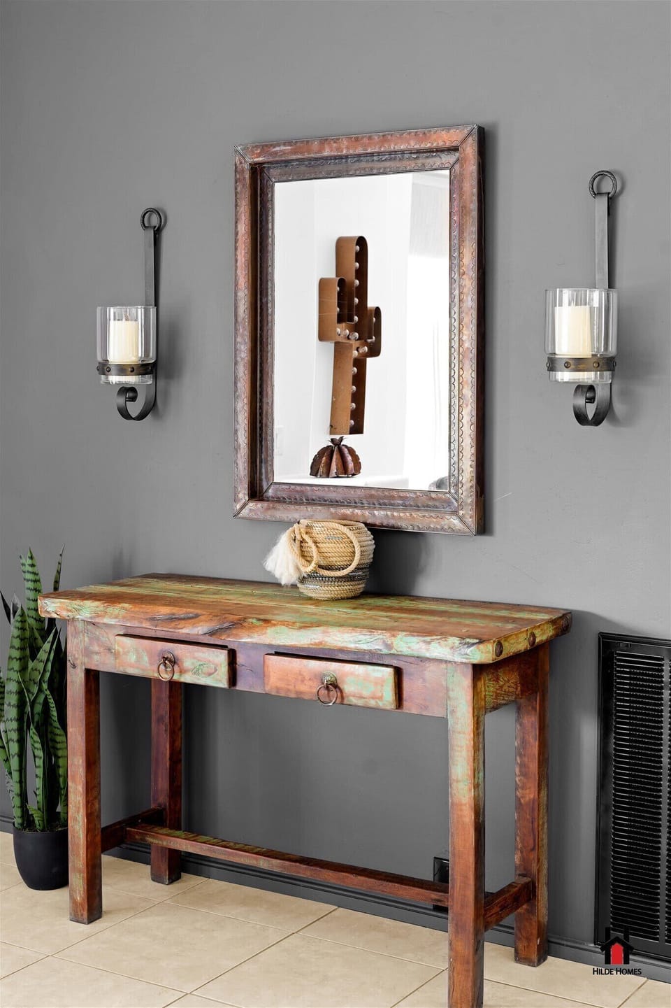 Vintage-inspired console table with a mirror and wall sconces