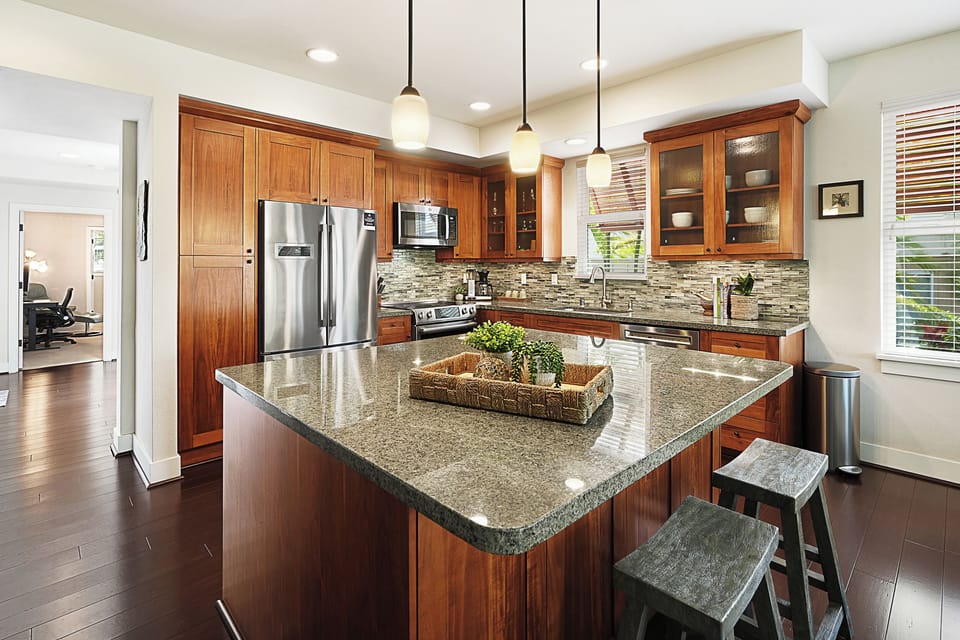 Easy meal prep in the fully-stocked kitchen with wide kitchen island for convenience.