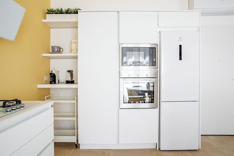 Apartment | Private kitchen | Espresso maker, electric kettle, highchair, dining tables