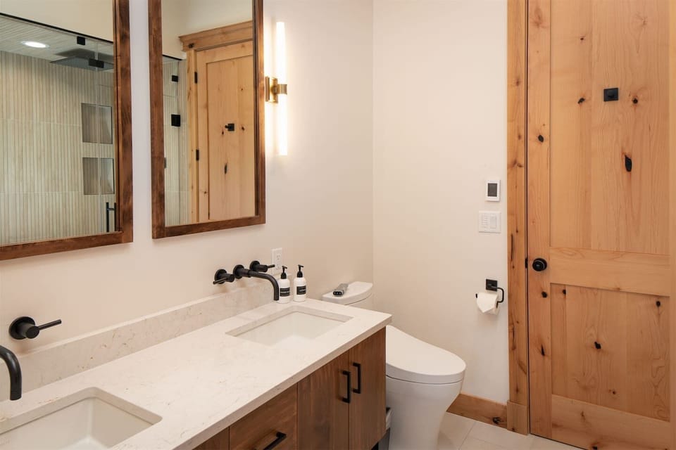 Bedroom 2 has a pass through bathroom that also serves the main living are of the condo. This bathroom also features a steam shower.