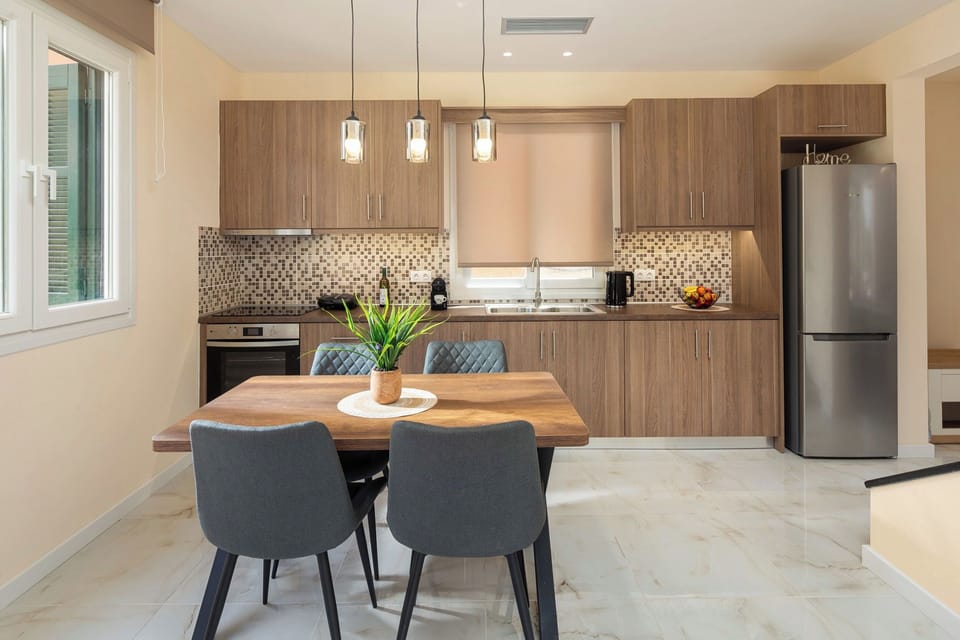 "Enjoy cooking in our modern kitchen, complete with all the essentials and a dining table for four."