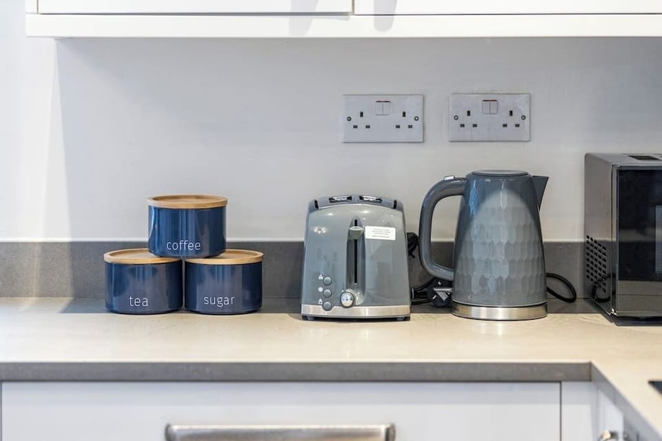 - Kitchen counter with toaster kettle and storage jars for convenience  
- Guests can easily make tea coffee or breakfast with modern appliances  
- Functional layout ensures comfort for everyday living  
