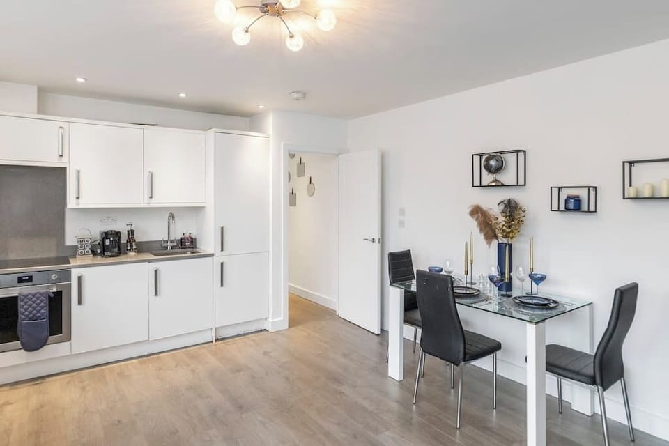 - Dining area with modern table setup and elegant black chairs  
- Adjacent to kitchen for seamless meals and entertaining nights  
- Perfect spot for breakfast, coffee or an intimate dinner  