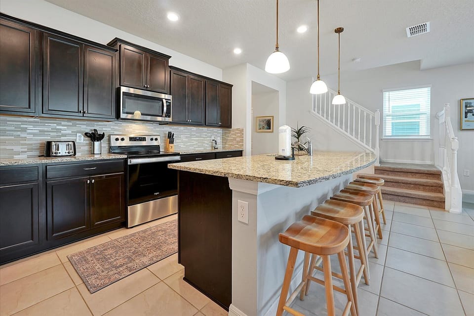 The kitchen has a large and spacious countertop for a delicious breakfast.