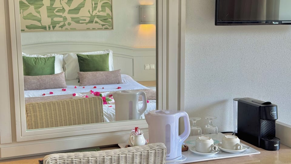 Executive Double Room | Minibar, individually decorated, desk, laptop workspace