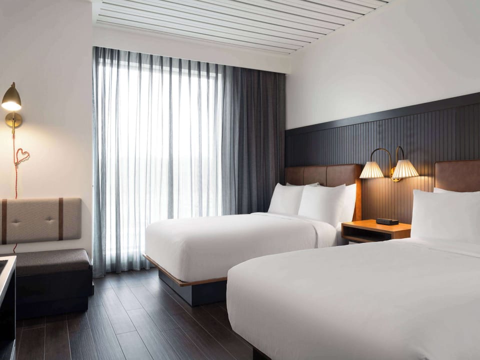 Room, 2 Queen Beds, Accessible (Mobility, Roll-in Shower) | Laptop workspace, blackout drapes, WiFi (free), bed sheets