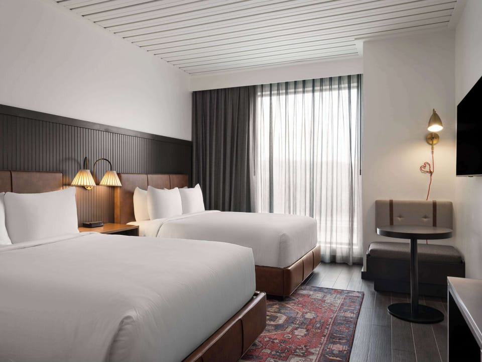 Room, 2 Queen Beds | Laptop workspace, blackout drapes, WiFi (free), bed sheets