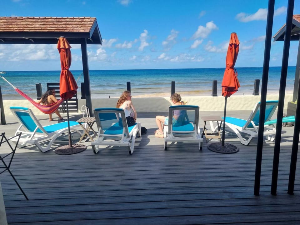 Bask in the stunning beachfront views right from our deck, perfect for sunbathing and relaxation.