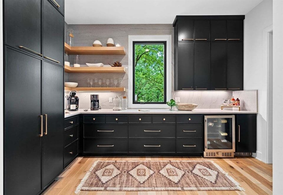 ooking is a delight in this spacious and light-filled kitchen, with stunning views to match. The large windows bring in plenty of natural light.