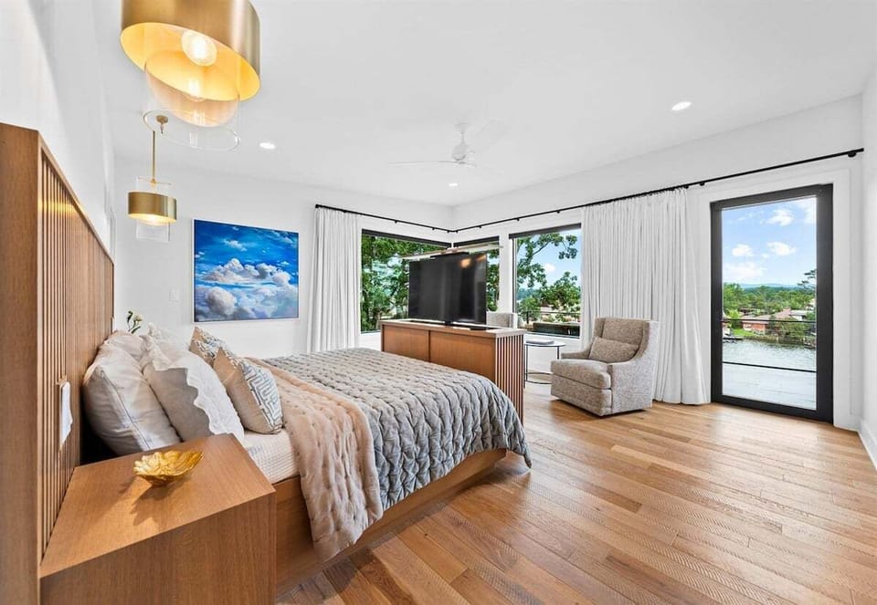 Relax in the luxurious comfort of this king bedroom, where modern design meets natural beauty.