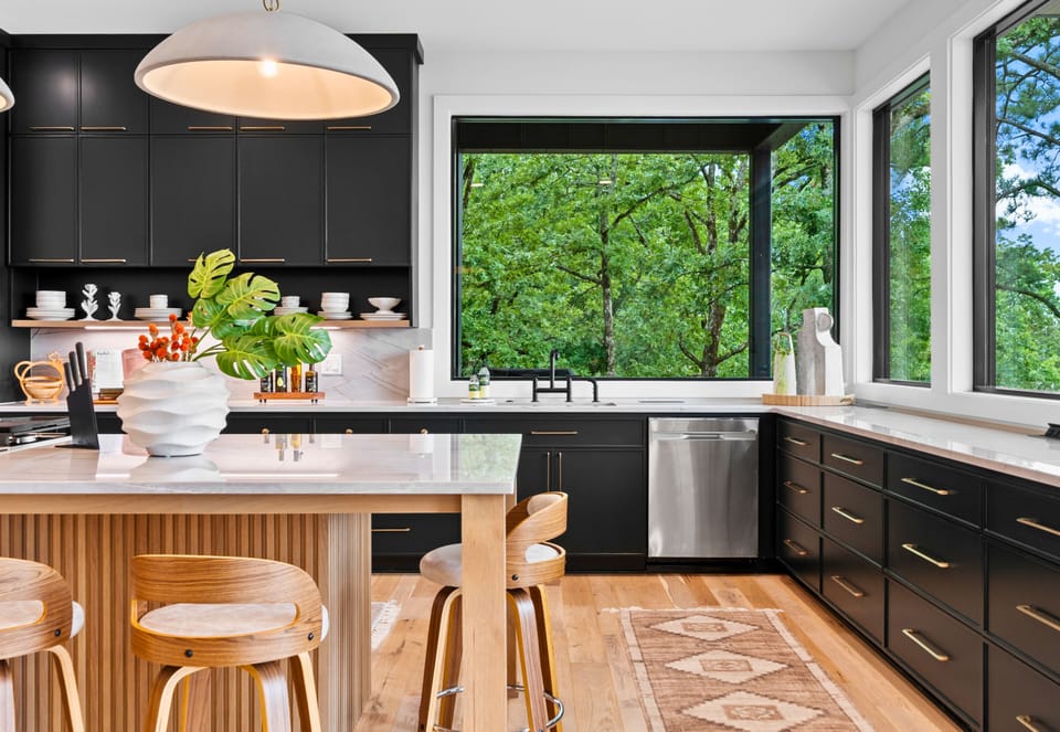 A chef's paradise, this kitchen combines sleek design with top-notch functionality. The spacious layout and modern appliances make cooking a delightful experience.