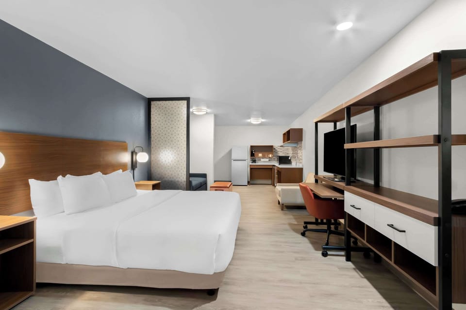 Suite, 1 King Bed, Non Smoking (Accessible Tub) | 1 bedroom, desk, laptop workspace, free rollaway beds