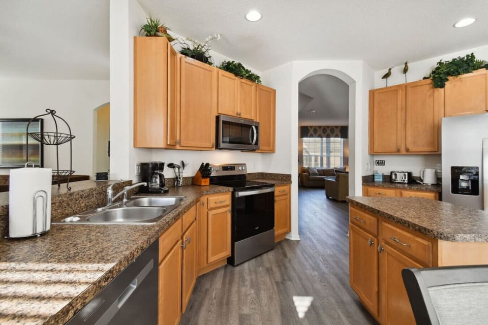 Fully equipped kitchen with ample counter space and stylish cabinetry.