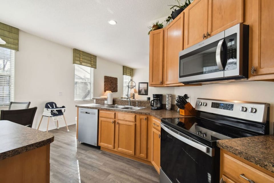 Bright and spacious kitchen with stainless steel appliances.
