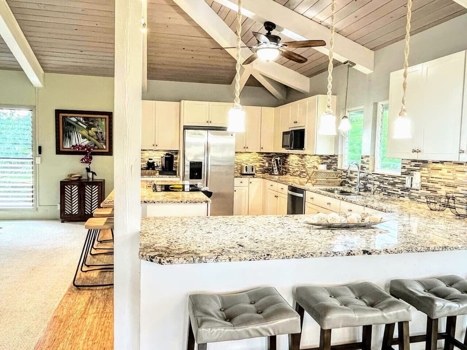 Eat breakfast at the kitchen peninsula with seating for four (or at the island with seating for three)