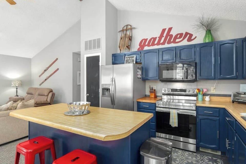 Cook with ease in the fully stocked kitchen overlooking the dining space.