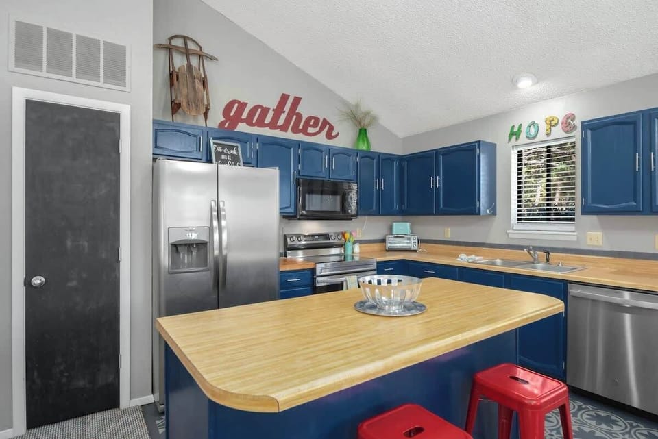 Cook with ease in the fully stocked kitchen overlooking the dining space.