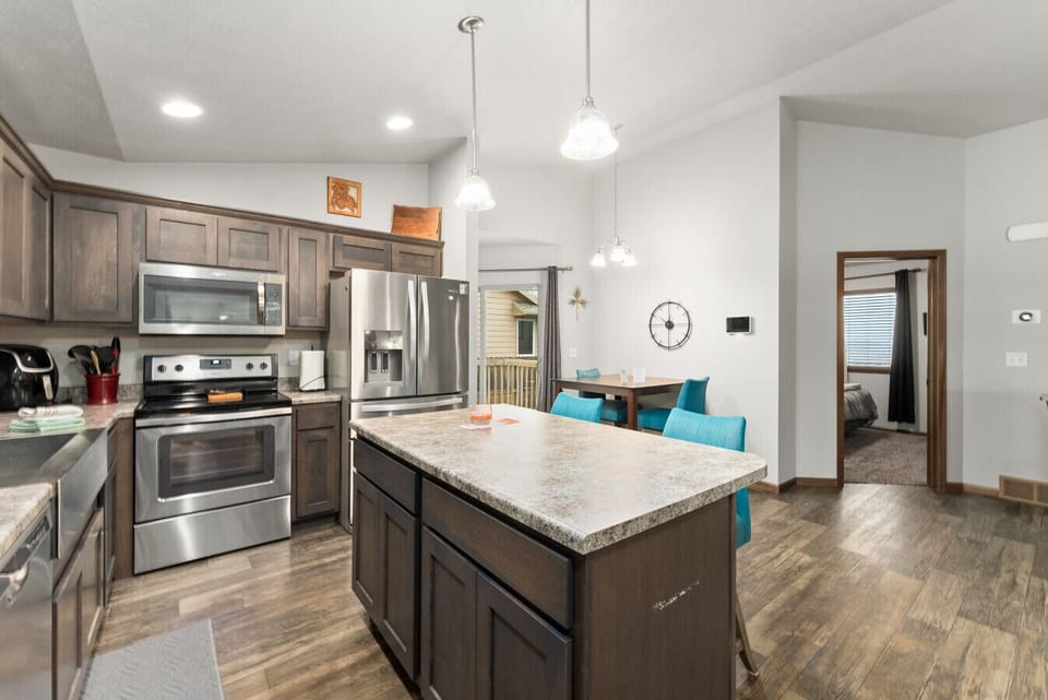 Spacious kitchen island for cooking or gathering around.