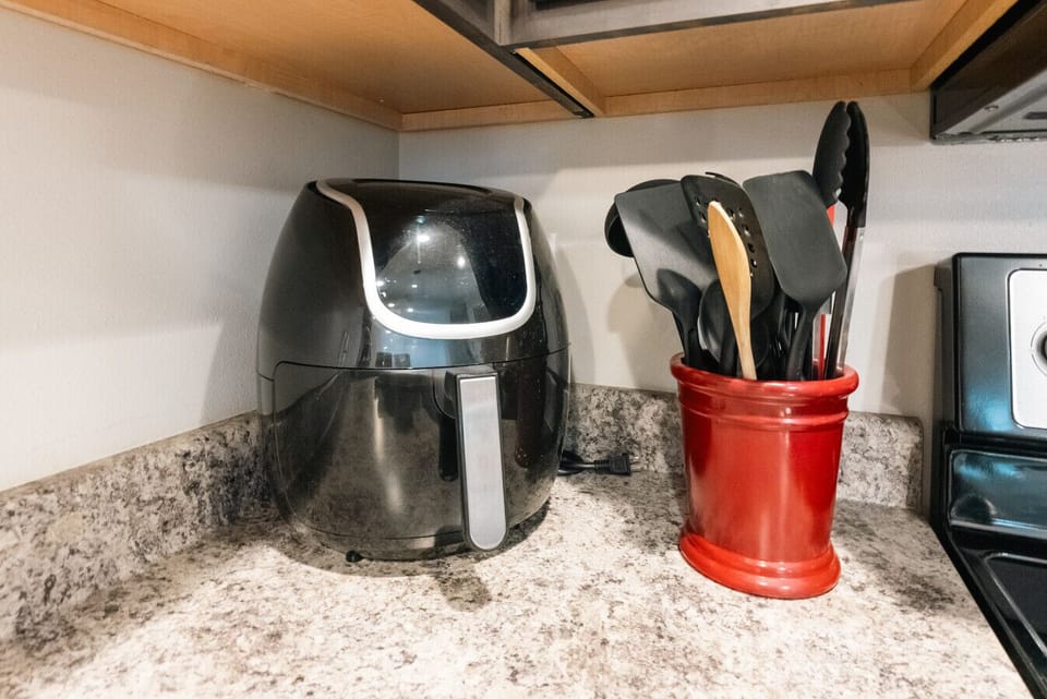 Fully stocked kitchen, including an air fryer for quick meals.