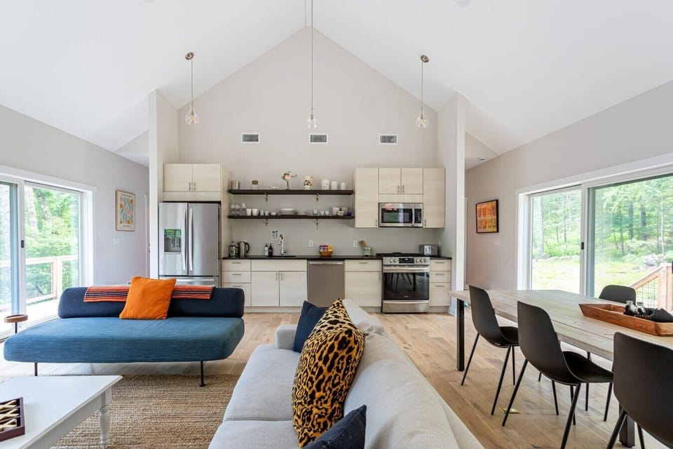 Floor-to-ceiling natural light brings the outdoors into this space