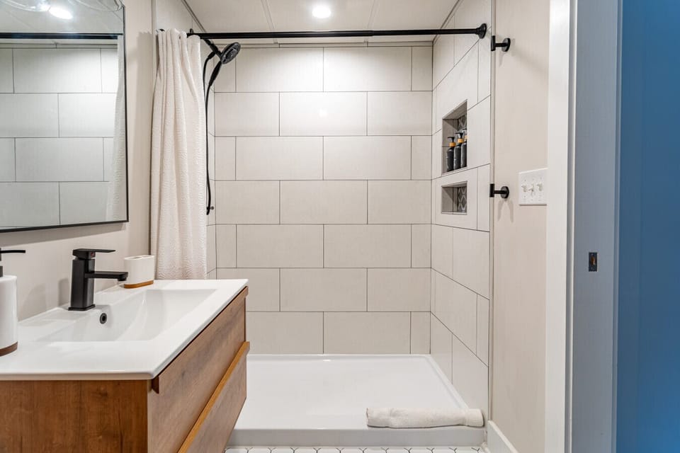 This bathroom includes a stand up shower