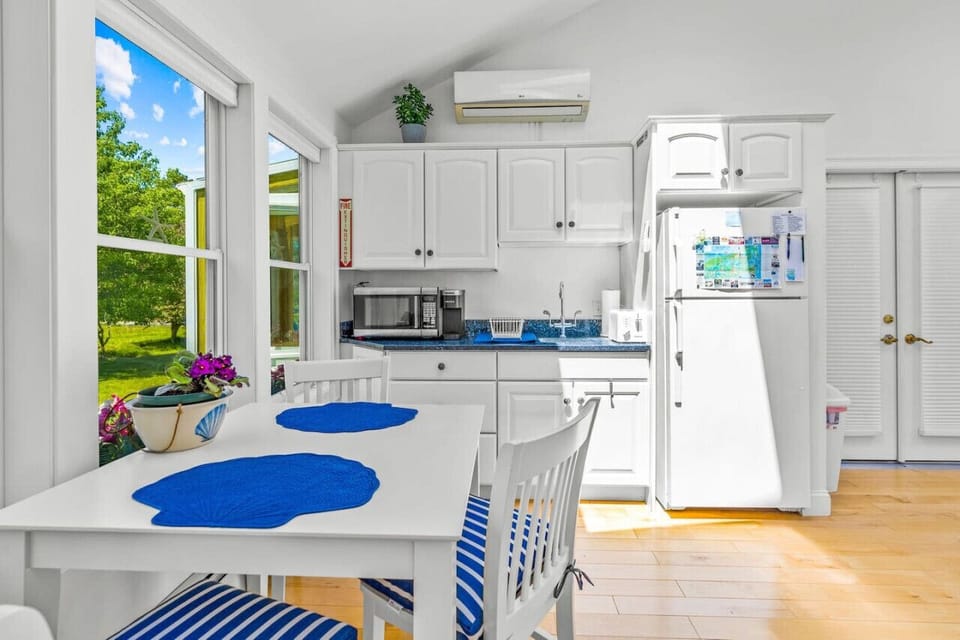 Your private kitchenette with a Keurig & K-cups, fridge, microwave, toaster, all the dish ware and utensils you'd need, lots of natural light, and seating for 3 at the dining table.