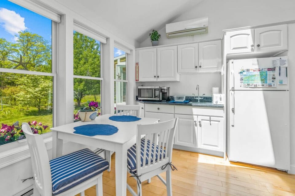 Your private kitchenette with a Keurig & K-cups, fridge, microwave, toaster, all the dish ware and utensils you'd need, lots of natural light, and seating for 3 at the dining table.