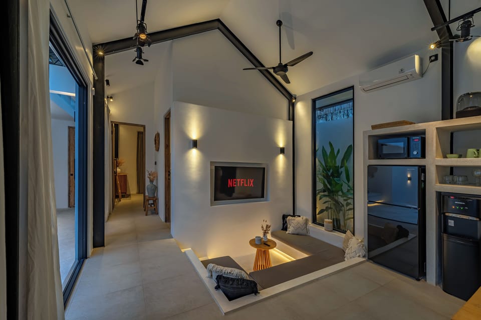 Deluxe Villa, 2 Bedrooms, Patio, Pool View | Living area | 52-inch LED TV with cable channels