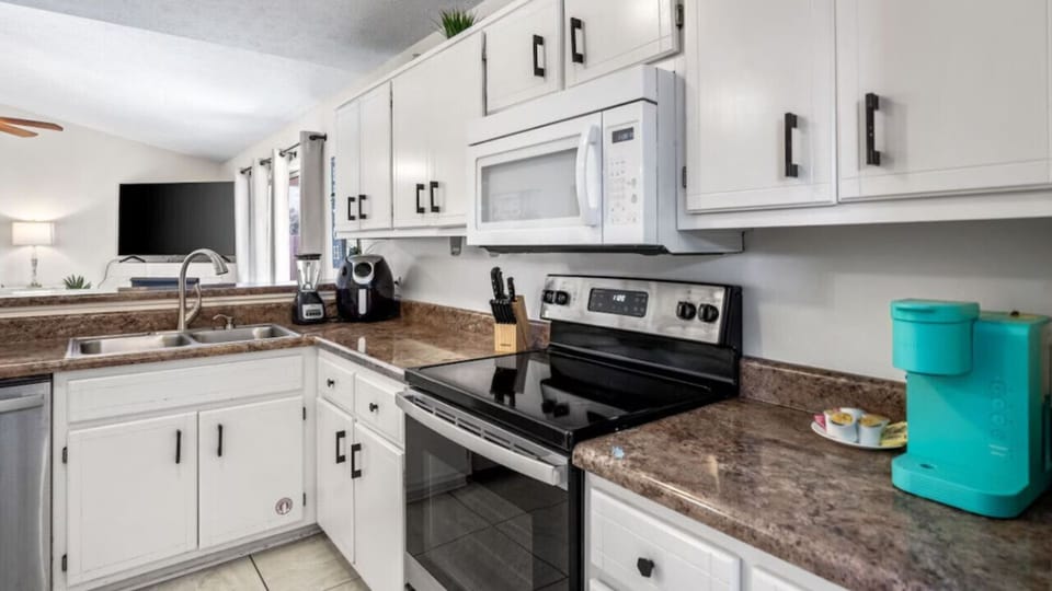 Your fully equipped kitchen features modern appliances and granite countertops, perfect for preparing meals during your stay.