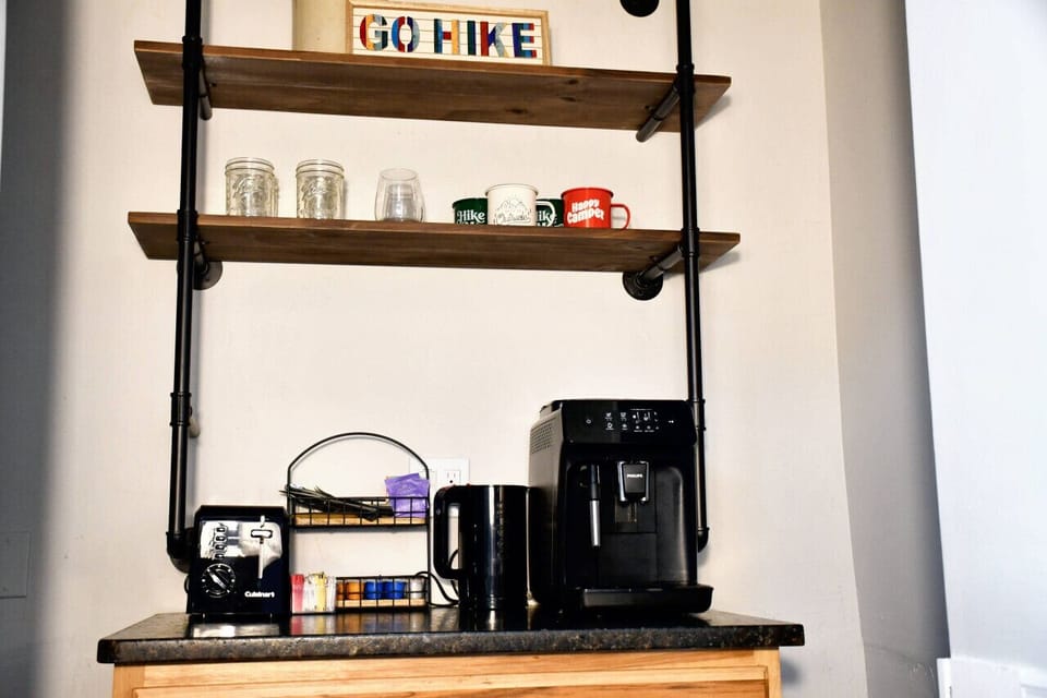Philips Super Automatic Espresso Machine with local coffee provided, toaster, and electric kettle. Perfect for enjoying a fresh cup of coffee before heading out to explore.