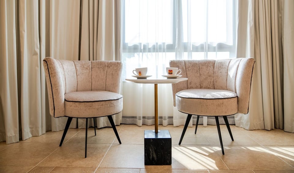 Luxury living space with comfy sofa , TV and everything you need
Enjoy coffee with 2 seater chair with a great view
