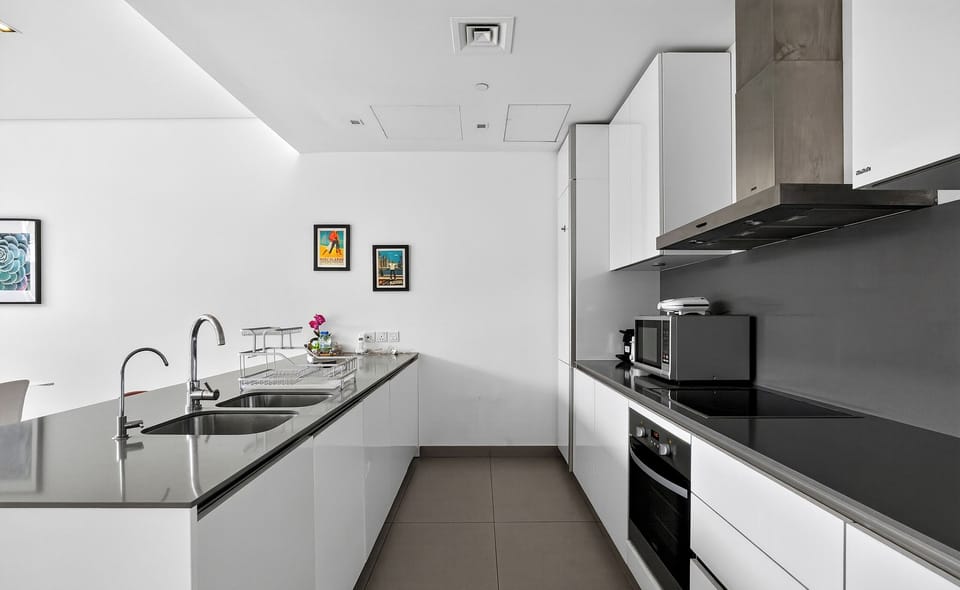 Luxury Apartment, Pool View | Private kitchen | Fridge, microwave, oven, stovetop