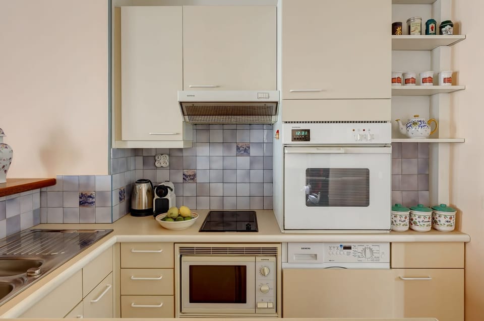 The kitchen is fully equipped to prepare a simple meal