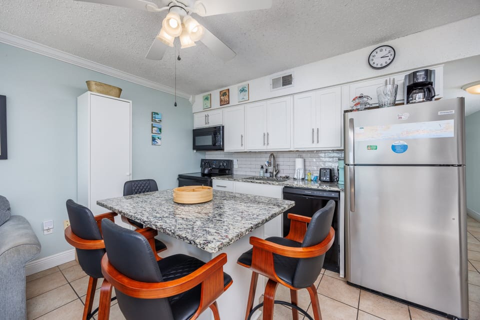 Fully applianced kitchen with island and all the cooking essentials