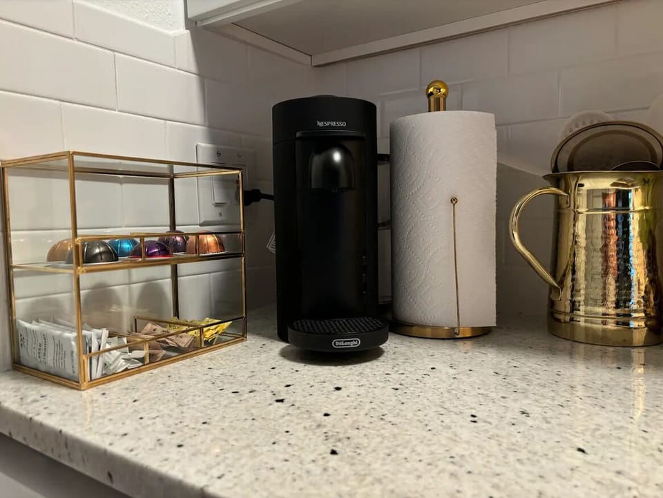 Complete coffee set up w/ Nespresso Vertuo w/ sugar and creamer options.