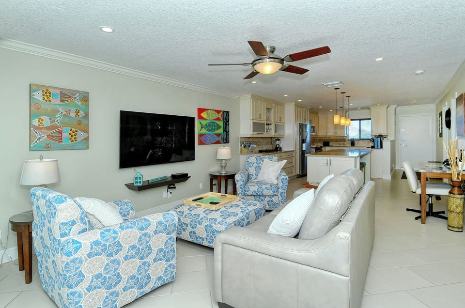 Living Area - Comfortable seating and large, flat-screened television.