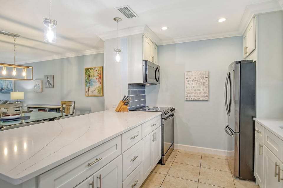 The condo offers an open concept with quartz countertops