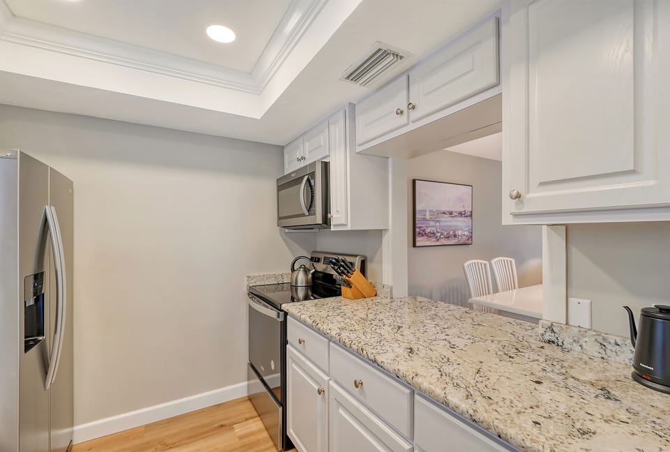 Kitchen - Fully equipped kitchen with pass-through to dining area.