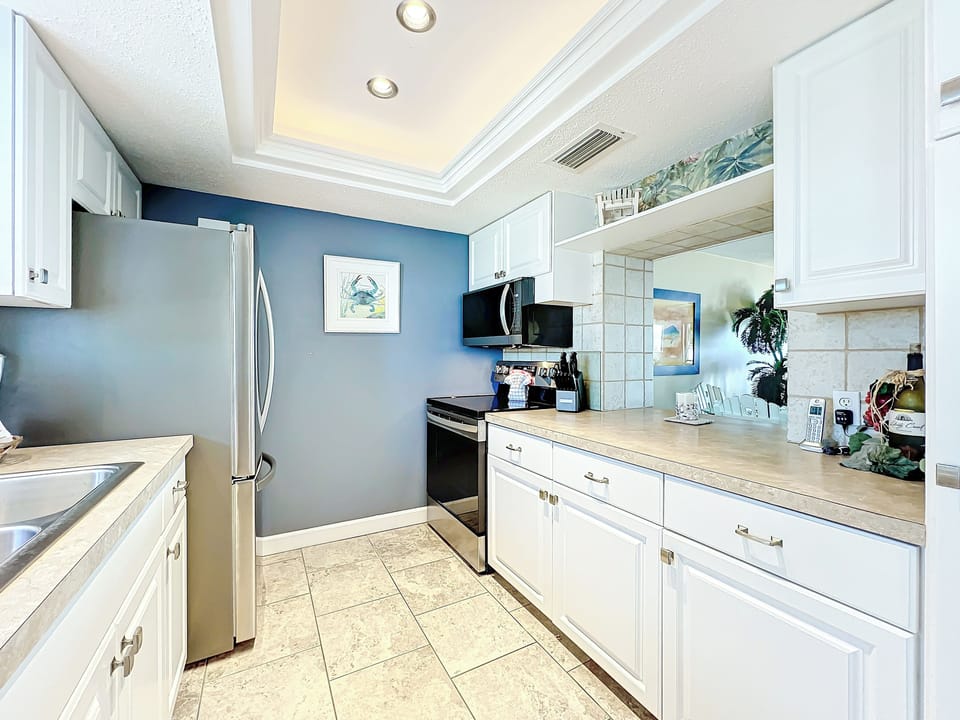 Kitchen pass thru opens to living area