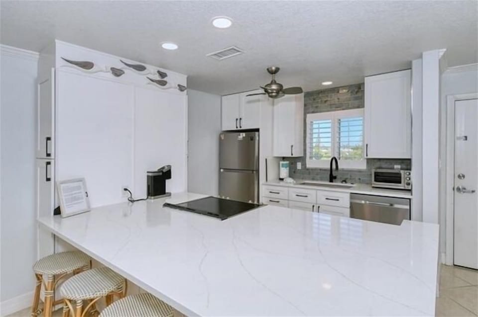 Kitchen - Large kitchen island with extra seating