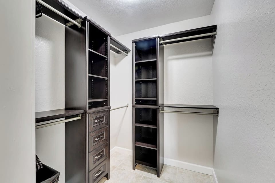 Walk-in Master Closet with Built In Cabinets