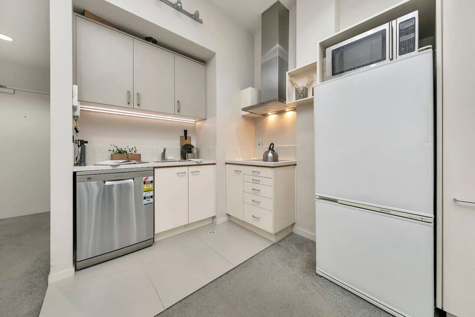 Cook with ease in a kitchen featuring stainless steel appliances, plenty of counter space, and storage.