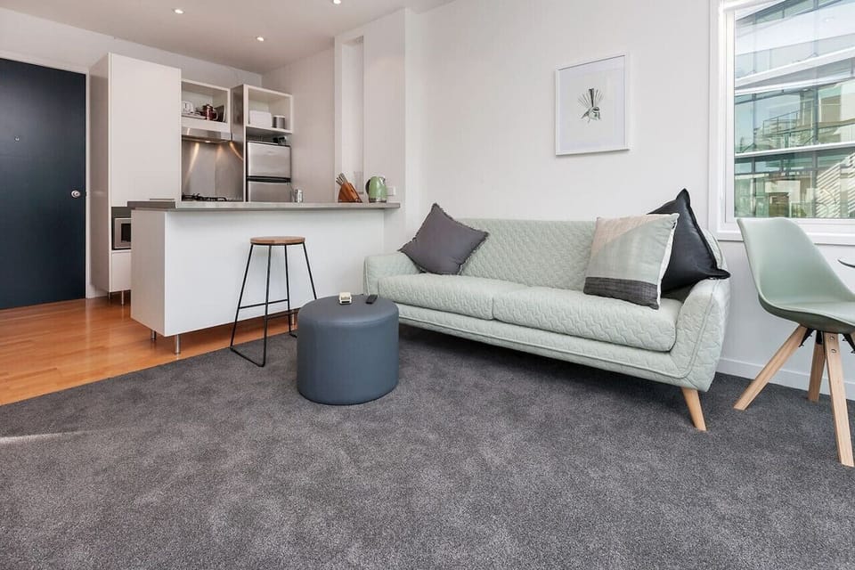 Relax in this stylish living space featuring a contemporary design, plush seating, and a cozy atmosphere.