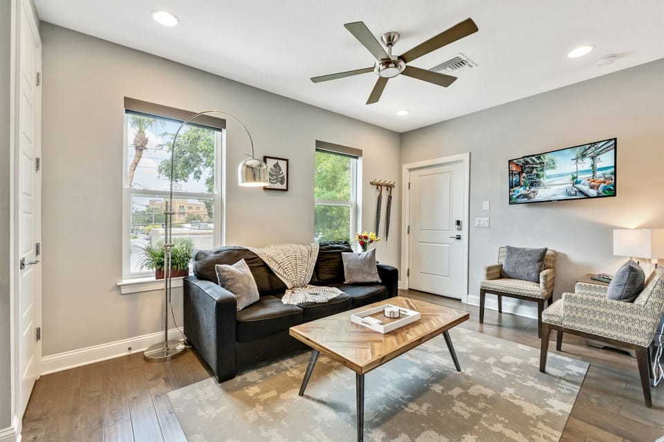 You'll be greeted by the warmth of a comfortable three-seater couch, beckoning you to sink in and make yourself at home.