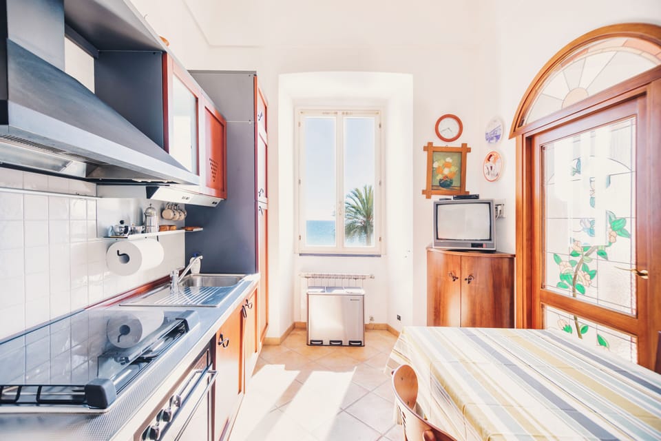 Apartment, Sea View | Private kitchen | Toaster, highchair
